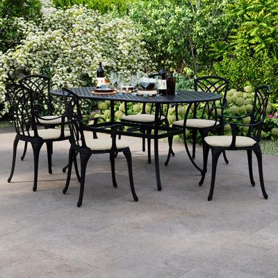 Dante 6 - Person Patio Dining Set Umbrella Hole Included Oval Table with Cushions Included