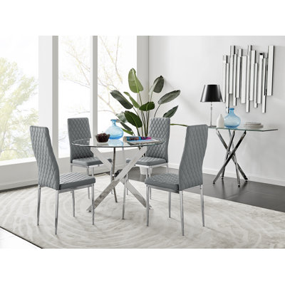 Ensemble de table de salle à manger ronde en métal et verre Tierra avec 4 chaises de salle à manger rembourrées en similicuir