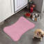 Tapis rose en forme d'os - 1 pièce
