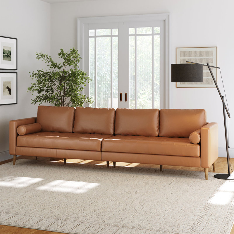 Canapé en cuir brun clair avec coussin de banc capitonné et structure en bois massif