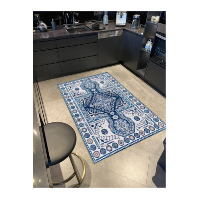 Tapis décoratif bleu marine à motif floral