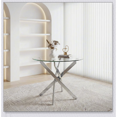 Table de salle à manger ronde en verre avec pieds argentés, moderne et durable pour les petits espaces et les repas élégants