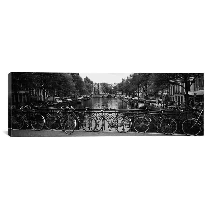 " Bicycle Leaning Against A Metal Railing On A Bridge, Amsterdam, Netherlands " by Panoramic Images, 12" H x 36" W x 1.5" D