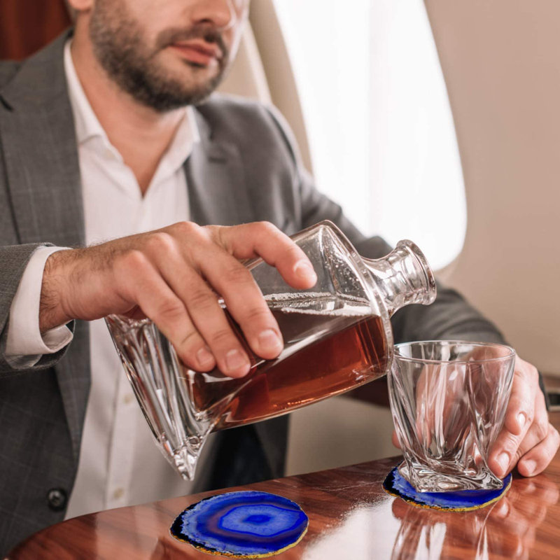 Ensemble de 4 sous-verres en agate bleue à bord doré