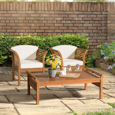 Stamford 49" Wide Solid Wood Outdoor Rectangular Coffee Table and 2 Chairs with Cushions