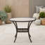 Table d'extérieur en rotin avec plateau et pieds en verre trempé