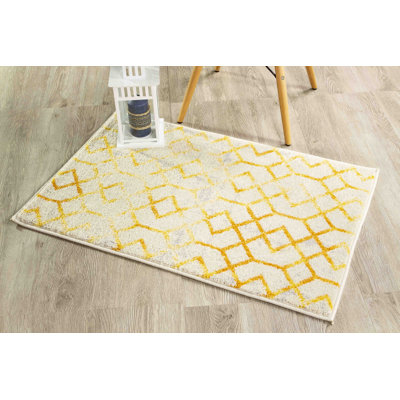 Tapis ivoire à motif géométrique