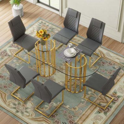 Ensemble de table et de chaises Table de salle à manger ovale en verre trempé de 71 pouces, style luxueux à double colonne dorée, chaises en polyuréthane de haute qualité avec pieds en métal arqués dorés, table moderne et ensemble de meubles 6 places