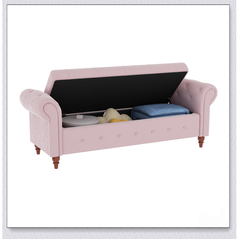 Banc de lit luxueux en velours rose avec rangement spacieux, parfait pour un décor moderne et élégant