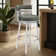 Deherrera Modern Swivel Counter or Bar Stool with Open Low Back and Footrest in Metal and Faux Leather