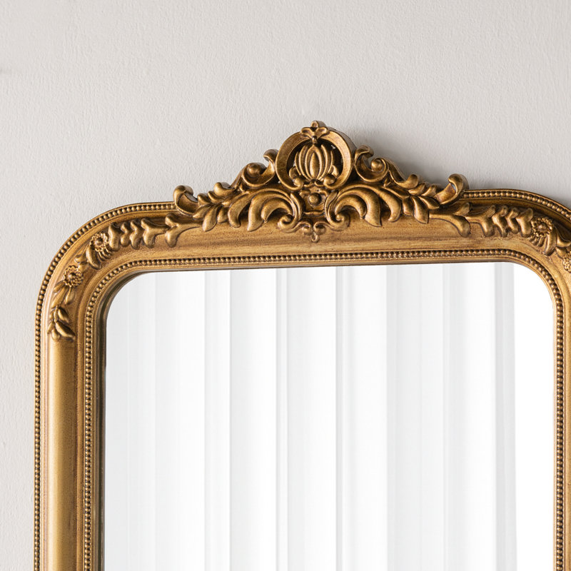 Miroir mural décoratif arqué avec motif de crête ornée