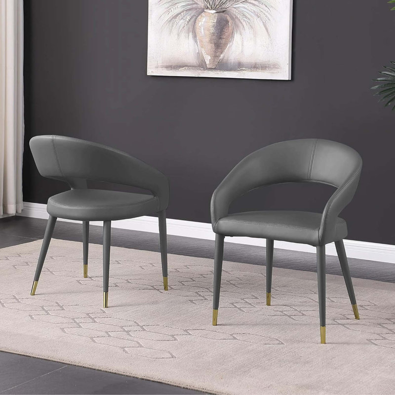 Chaises de salle à manger modernes en similicuir avec dossier incurvé et détails dorés