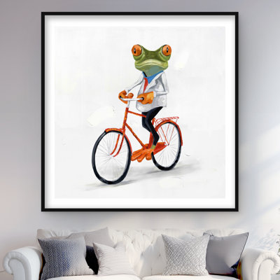 Drôle de grenouille chevauchant un vélo - décor encadré vert