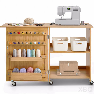 Armoire de table pliante polyvalente pour machine à coudre avec roulettes, tablettes et portes magnétiques - couleur bois