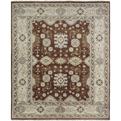 Misael Wool Oriental Area Rug in Brown/Ivory