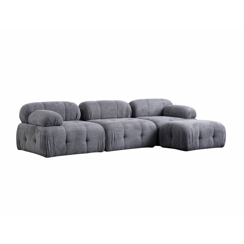 Élégant canapé d'angle | Structure en bois de hêtre durable et en carton, tissu 100% polyester | Support pour le dos en mousse et en silicone gris doux | Design moderne avec pieds en plastique noir | Parfait pour les salons et les salons