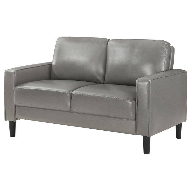 Causeuse rembourrée avec accoudoirs Farallone, parfaite pour la vie moderne avec confort et style dans des espaces compacts.