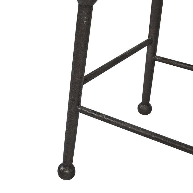 Tabouret de bar Cashew Saddle, hauteur de comptoir, piètement en métal industriel et placage, idéal pour les cuisines, bars et salles à manger, avec tables colorées.