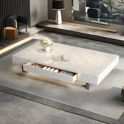 Simple rectangular rock slab floating coffee table by Creature B Comforts