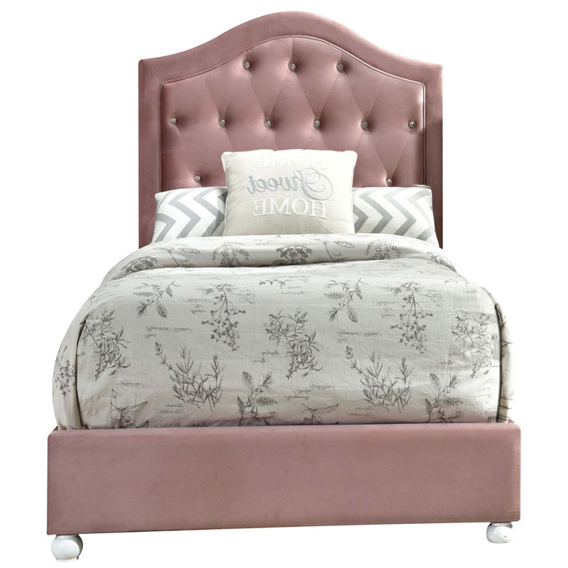 Lit simple tapissier rose avec tête de lit capitonnée arquée, sans sommier