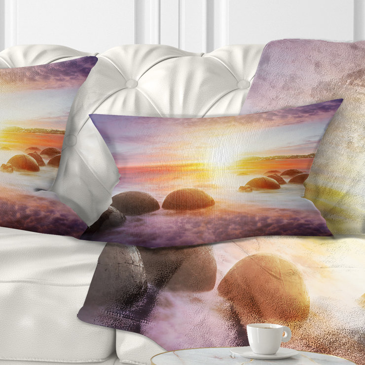 Housse de coussin rectangulaire en forme de soleil sur les rochers Moeraki