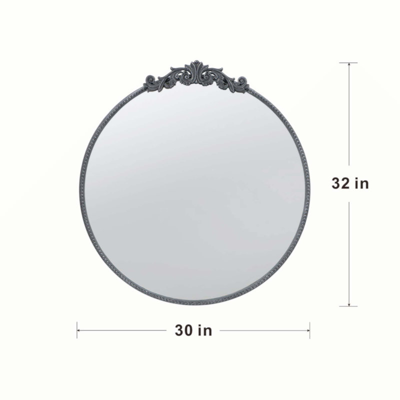 Miroir de conception classique avec forme ronde et cadre d'inspiration baroque pour la salle de bain, console de vestibule posée contre le mur