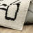 Hennings Mid-Century Modern Beige/ Black Area Rug-1408701484