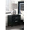 Élégante table de chevet moderne avec finition en bois noir et deux tiroirs, parfaite pour un décor de chambre à coucher glamour.