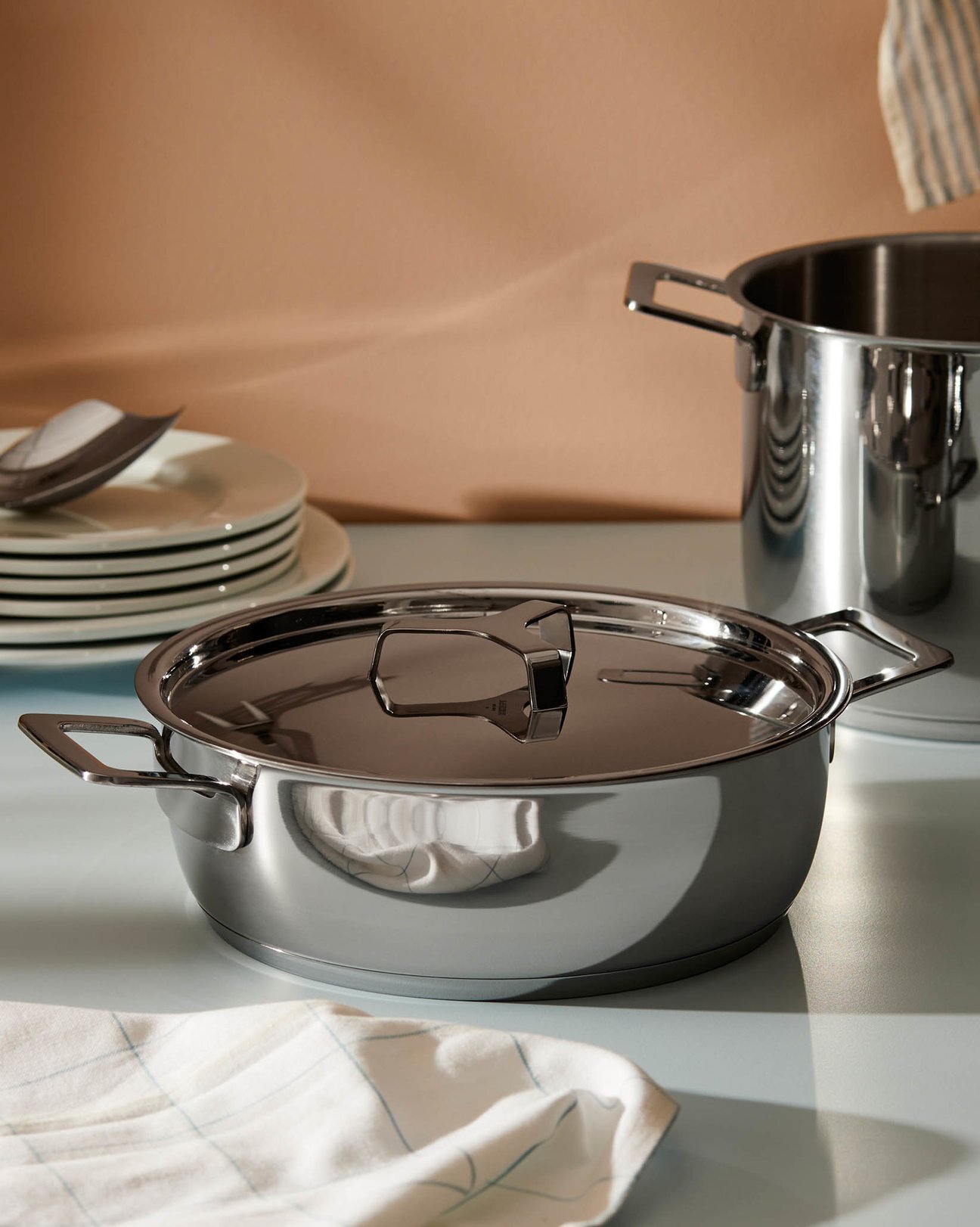 https://assets.wfcdn.com/im/88020004/compr-r85/1670/167063876/post-pans-stainless-steel-round-casserole-with-lid.jpg