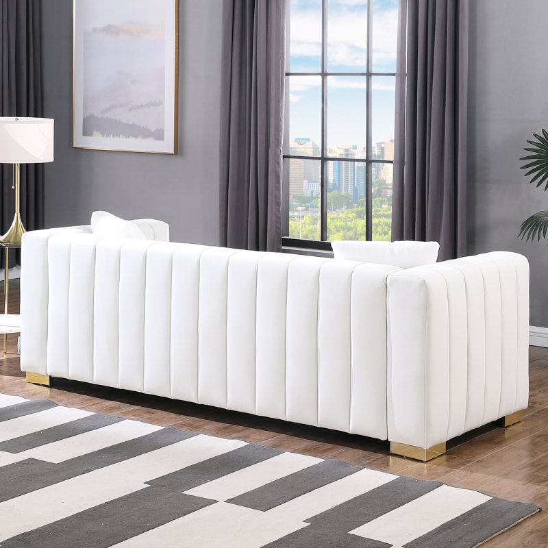 Élégant canapé en velours blanc avec coussins en mousse relaxants modernes