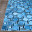 Tapis bleu à motif géométrique-847203144