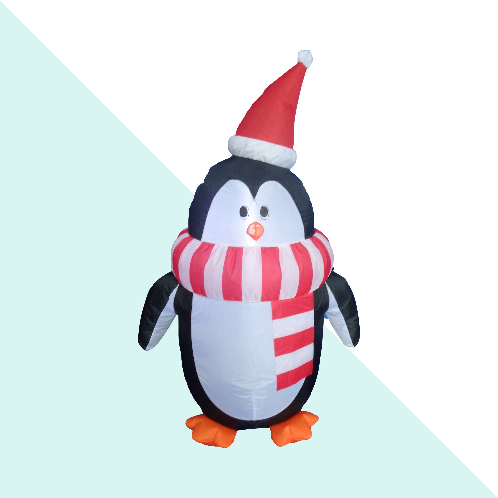 Cute happy joyful Christmas penguin in cozy sweater and scarf