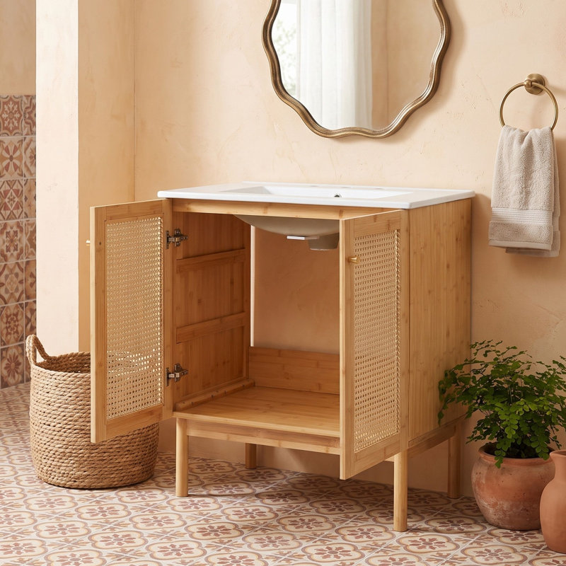 Meuble-lavabo de salle de bain avec lavabo en céramique et portes en rotin