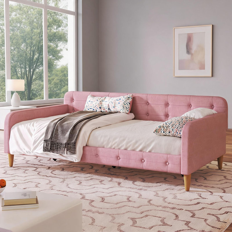 Lit de jour tapissier simple rose avec 4 pieds de soutien, sièges multifonctionnels et couchage pour la chambre à coucher et l'espace de vie