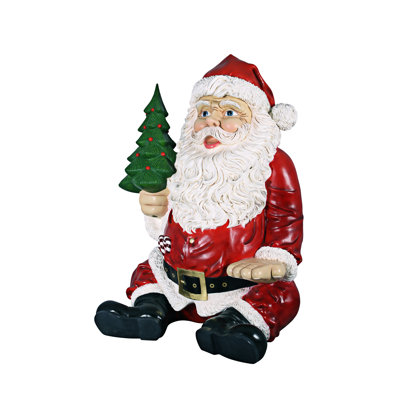 Statue géante de père Noël assis avec siège à main