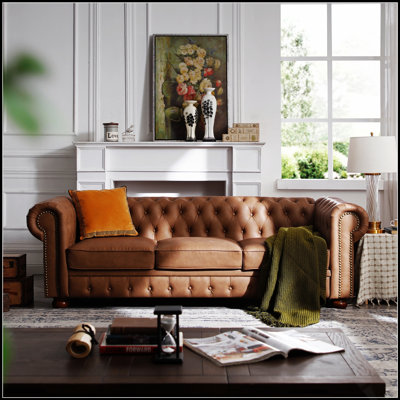 Canapé Chesterfield en similicuir de charme offrant un confort ultime et un style intemporel pour les espaces de vie modernes