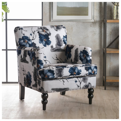 Fauteuil club contemporain en tissu multicolore, dossier serré avec pieds tournés en bois Harrison