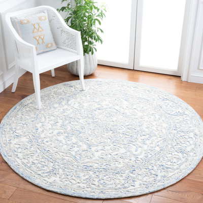 Tapis bleu / ivoire en laine touffeté à la main Conard