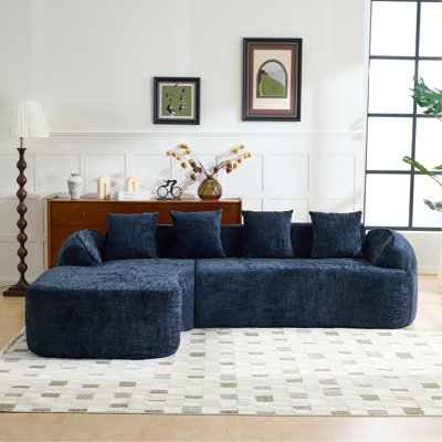 Dark Bule Chenille L-Shaped Compressed Sofa That Goes Well With Any Living Room. It Features High-Elastic Sponge For A Comfortable Sitting Feel,  Curved Armrests And Four Throw Pillows.