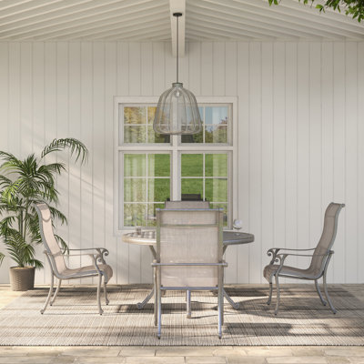 Annecorinne 4 - Person Patio Dining Set with Round Table
