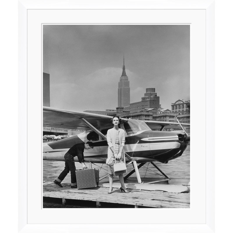 Vogue Magazine, "Woman By A Seaplane," John Rawlings, May 15, 1954 Print by Condé Nast, 51.5" H x 43.5" W