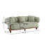 Canapé à accoudoirs arrondis avec design ergonomique et support confortable, parfait pour les décors modernes et Mid-Century.