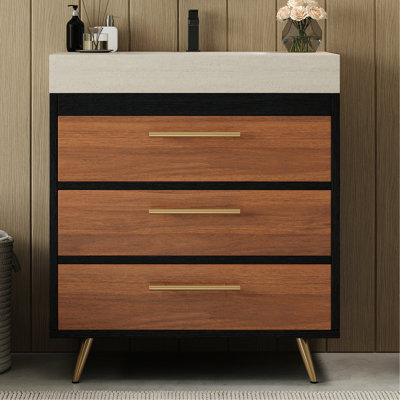 Meuble-lavabo de salle de bain moderne avec lavabo vasque en céramique, plateau en pierre frittée, grand espace de rangement, pieds en acier inoxydable aux accents dorés, idéal pour les salles de bain minimalistes.