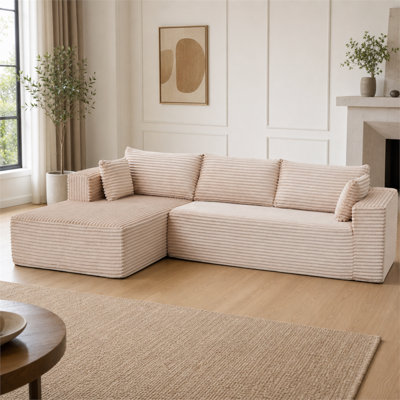 Beige corduroy L-shaped modular sofa bed featuring a deep seat and a chaise longue; suitable for a variety of spatial settings.