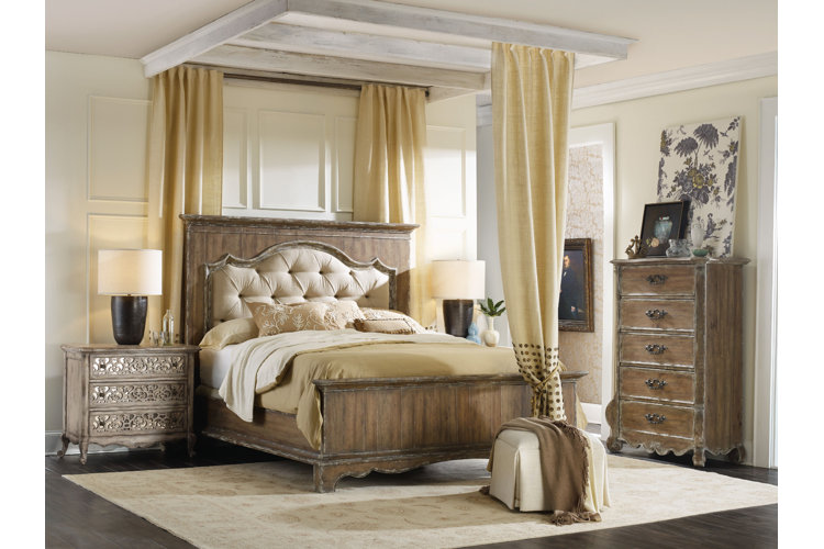 Traditional-style bedroom with ceiling canopy above bed suspended with curtain rods