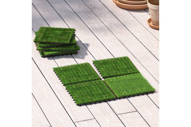 four pieces of artificial turf pieced together