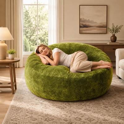 Pouf poire en fausse fourrure douce et moelleuse avec rembourrage en mousse à mémoire de forme pour un confort relaxant dans le salon et la chambre.
