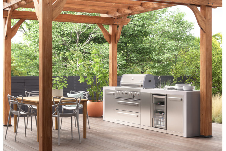 wood pergola over an outdoor kitchen and outdoor dining area
