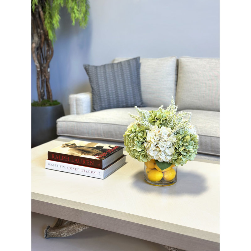 Hydrangeas Arranged in Glass Vase with Lemons