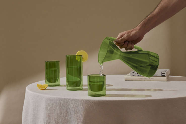 glassware sizes short medium and tall sized drinking glass and an hourglass shaped pitcher